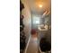 Bright laundry room with washer, dryer, storage shelves, and tile flooring at 2303 Condor Dr, Lawrenceville, GA 30044