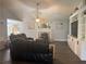 Inviting living room featuring a fireplace, built-in shelving, and ample seating at 2303 Condor Dr, Lawrenceville, GA 30044