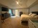 Main bedroom with a ceiling fan, ensuite bathroom, large dresser, and plush carpet at 2303 Condor Dr, Lawrenceville, GA 30044