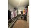 Walk-in closet with lots of clothing hanging at 2303 Condor Dr, Lawrenceville, GA 30044