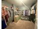 Walk-in closet with rods and shelving for storage at 2303 Condor Dr, Lawrenceville, GA 30044