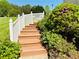 Stairway to fenced yard and landscaping at 3076 Harris Mill Ct, Duluth, GA 30096