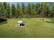 Expansive backyard with lush green lawn and a gazebo, offering a serene outdoor retreat at 3076 Harris Mill Ct, Duluth, GA 30096