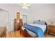 Comfortable bedroom with hardwood floors, natural light, and nice furnishings at 3076 Harris Mill Ct, Duluth, GA 30096