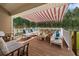 Inviting covered deck area with comfortable seating, perfect for relaxing and entertaining outdoors at 3076 Harris Mill Ct, Duluth, GA 30096