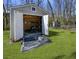 Spacious shed with an open door, offering ample storage space in the backyard at 3076 Harris Mill Ct, Duluth, GA 30096
