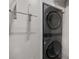 Space-saving stackable washer and dryer in a dedicated laundry area at 3076 Harris Mill Ct, Duluth, GA 30096