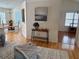 Open concept living room and dining room with hardwood floors and lots of natural light at 3076 Harris Mill Ct, Duluth, GA 30096