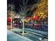 Inviting town square at night with outdoor seating and festive lighting at 3076 Harris Mill Ct, Duluth, GA 30096