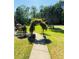 Inviting walkway lined with greenery and leading to a beautiful home at 3076 Harris Mill Ct, Duluth, GA 30096