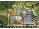 Aerial view of the golf course, pools, tennis courts, and clubhouse of the community at 3459 Clubland Dr, Marietta, GA 30068