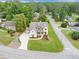 Aerial view of an immaculate home on a manicured lot with mature trees and landscaped areas at 3459 Clubland Dr, Marietta, GA 30068