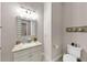 Bathroom view featuring a mirror, sink and toilet at 3459 Clubland Dr, Marietta, GA 30068