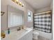 Bathroom featuring a large mirror, white vanity, and a shower with a gray and white striped curtain at 3459 Clubland Dr, Marietta, GA 30068
