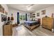 Bedroom has a wood bed frame and colorful decor at 3459 Clubland Dr, Marietta, GA 30068
