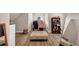 Walk-in closet has a padded ottoman, clothing racks and shelving for accessories at 3459 Clubland Dr, Marietta, GA 30068