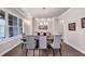 Elegant dining room featuring a large table, modern chandelier, and natural light at 3459 Clubland Dr, Marietta, GA 30068