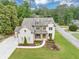 Exterior elevation of a two-story home featuring professional landscaping, brick, and a manicured lawn at 3459 Clubland Dr, Marietta, GA 30068