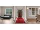 Bright foyer with hardwood floors, a dark wood door, and views to living areas at 3459 Clubland Dr, Marietta, GA 30068