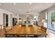 Expansive kitchen features custom cabinets, stainless steel appliances, a center island with seating, and a dining area at 3459 Clubland Dr, Marietta, GA 30068