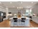 Modern kitchen with stainless steel appliances, a central island, pendant lighting, and ample counter space at 3459 Clubland Dr, Marietta, GA 30068
