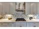 Gourmet kitchen with stainless steel appliances, granite countertops, and stylish backsplash at 3459 Clubland Dr, Marietta, GA 30068