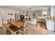 Bright, open kitchen featuring a central island, stainless steel appliances, and dining table with bench seating at 3459 Clubland Dr, Marietta, GA 30068