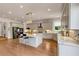 Modern kitchen features a center island, stainless steel appliances, and custom cabinetry at 3459 Clubland Dr, Marietta, GA 30068