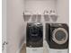 Laundry room features front load washer and dryer, and a wire shelf at 3459 Clubland Dr, Marietta, GA 30068