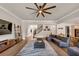 Spacious living area with dark wood floors, comfortable seating, and seamless flow to other rooms at 3459 Clubland Dr, Marietta, GA 30068
