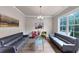 Spacious living room featuring modern furnishings, hardwood floors, and ample natural light at 3459 Clubland Dr, Marietta, GA 30068