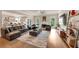 Open-concept living room with a fireplace, large sectional sofa, and access to the kitchen at 3459 Clubland Dr, Marietta, GA 30068