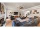 Elegant living space boasts a fireplace, media center, plush seating, and easy access to the staircase at 3459 Clubland Dr, Marietta, GA 30068