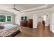 Spacious main bedroom features tray ceiling, wood floors, ceiling fan, large windows and ample natural light at 3459 Clubland Dr, Marietta, GA 30068