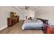Spacious main bedroom features tray ceiling, wood floors, ceiling fan, large windows and ample natural light at 3459 Clubland Dr, Marietta, GA 30068