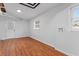 Finished basement with painted walls, updated flooring, and a glass door providing natural light at 2002 Twin Falls Rd, Decatur, GA 30032