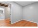 Bedroom featuring hardwood floors, fresh paint, and a view to an adjacent updated bathroom at 2002 Twin Falls Rd, Decatur, GA 30032
