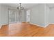 Dining area featuring hardwood floors, modern lighting and sliding glass door to the backyard at 2002 Twin Falls Rd, Decatur, GA 30032