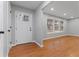 Inviting entryway with hardwood floors, a white front door, and natural light streaming through the windows at 2002 Twin Falls Rd, Decatur, GA 30032