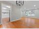 Open-concept living area with hardwood floors, recessed lighting, connecting to the kitchen with backyard pool view at 2002 Twin Falls Rd, Decatur, GA 30032