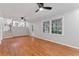 Open-concept living area with wood-look floors and access to the kitchen at 2002 Twin Falls Rd, Decatur, GA 30032