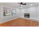 Bright living room featuring a decorative fireplace and large windows at 2002 Twin Falls Rd, Decatur, GA 30032