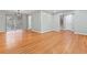 Open-concept living and dining area with hardwood floors, modern lighting, and a sliding door to the backyard at 2002 Twin Falls Rd, Decatur, GA 30032