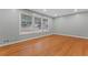 Bright living room featuring gleaming hardwood floors, fresh paint, and large windows offering plenty of natural light at 2002 Twin Falls Rd, Decatur, GA 30032