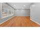 Spacious living room featuring hardwood floors, neutral paint, recessed lights and multiple windows at 2002 Twin Falls Rd, Decatur, GA 30032