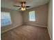 Bedroom featuring neutral color paint, ceiling fan, carpet flooring, and natural light at 2266 Eastgate Dr, Snellville, GA 30078