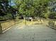 New wooden deck featuring a railing and stairs leading to the yard at 2266 Eastgate Dr, Snellville, GA 30078