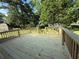 New wooden deck with railings overlooking the backyard; perfect for outdoor entertaining at 2266 Eastgate Dr, Snellville, GA 30078