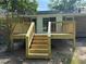 New wooden deck with stairs, providing access to the yard; perfect for outdoor entertaining at 2266 Eastgate Dr, Snellville, GA 30078