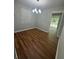 Dining room area with hardwood floors and access to an outdoor deck at 2266 Eastgate Dr, Snellville, GA 30078